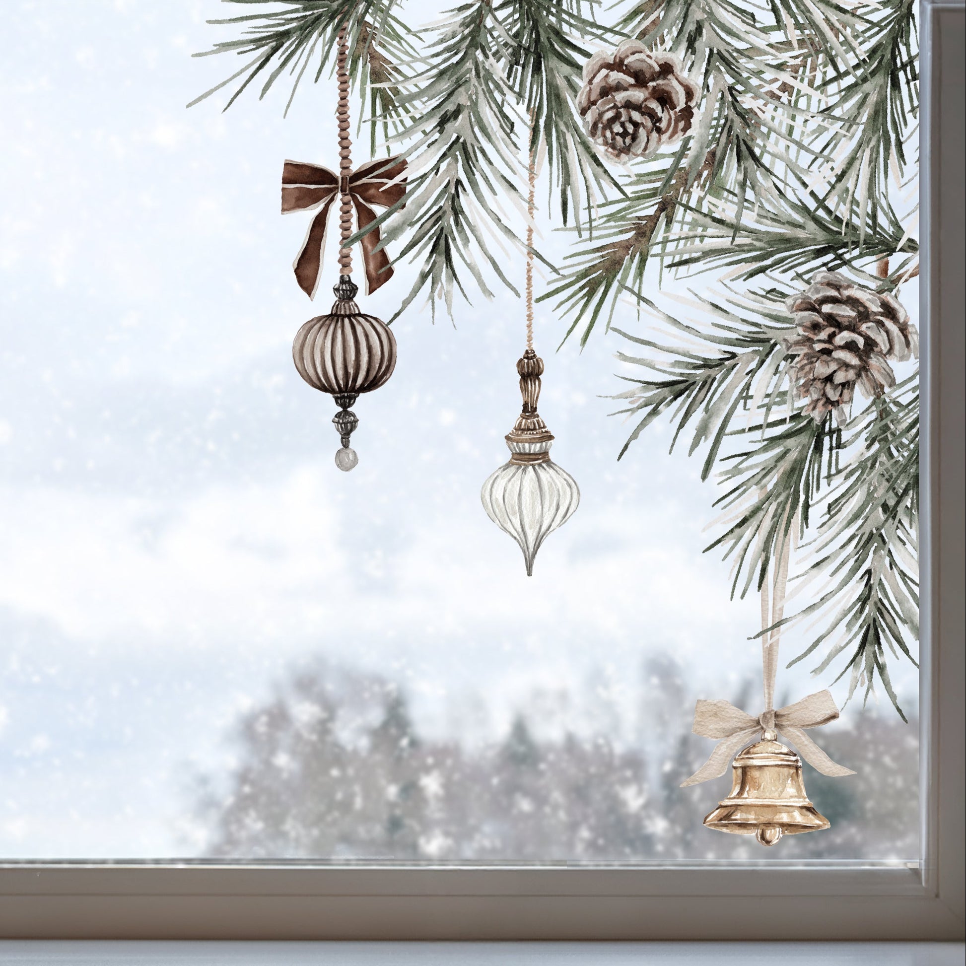 Three rustic Christmas ornaments hanging from pine tree branches in front of a snowy window. The ornaments include a brown ribbed glass ball with a brown bow, a clear glass teardrop, and a gold bell with a white bow.